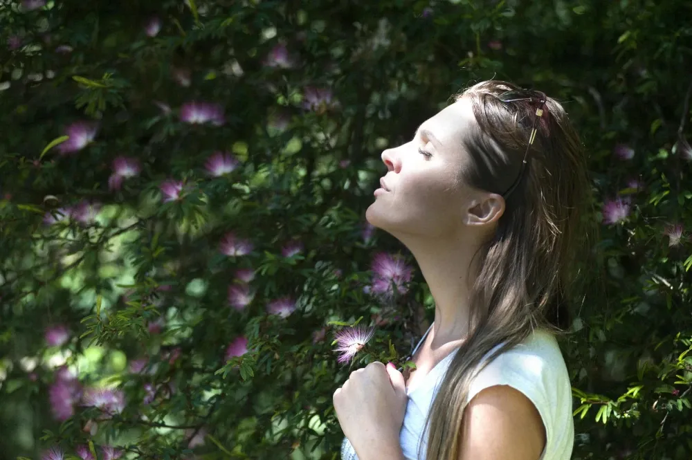 Women deep breathing to help ease anxiety 